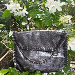 Chic Black Chain-Trimmed Women's Bag for that special night out.